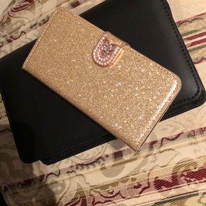 iPhone X/Xs gold glittery phone case.